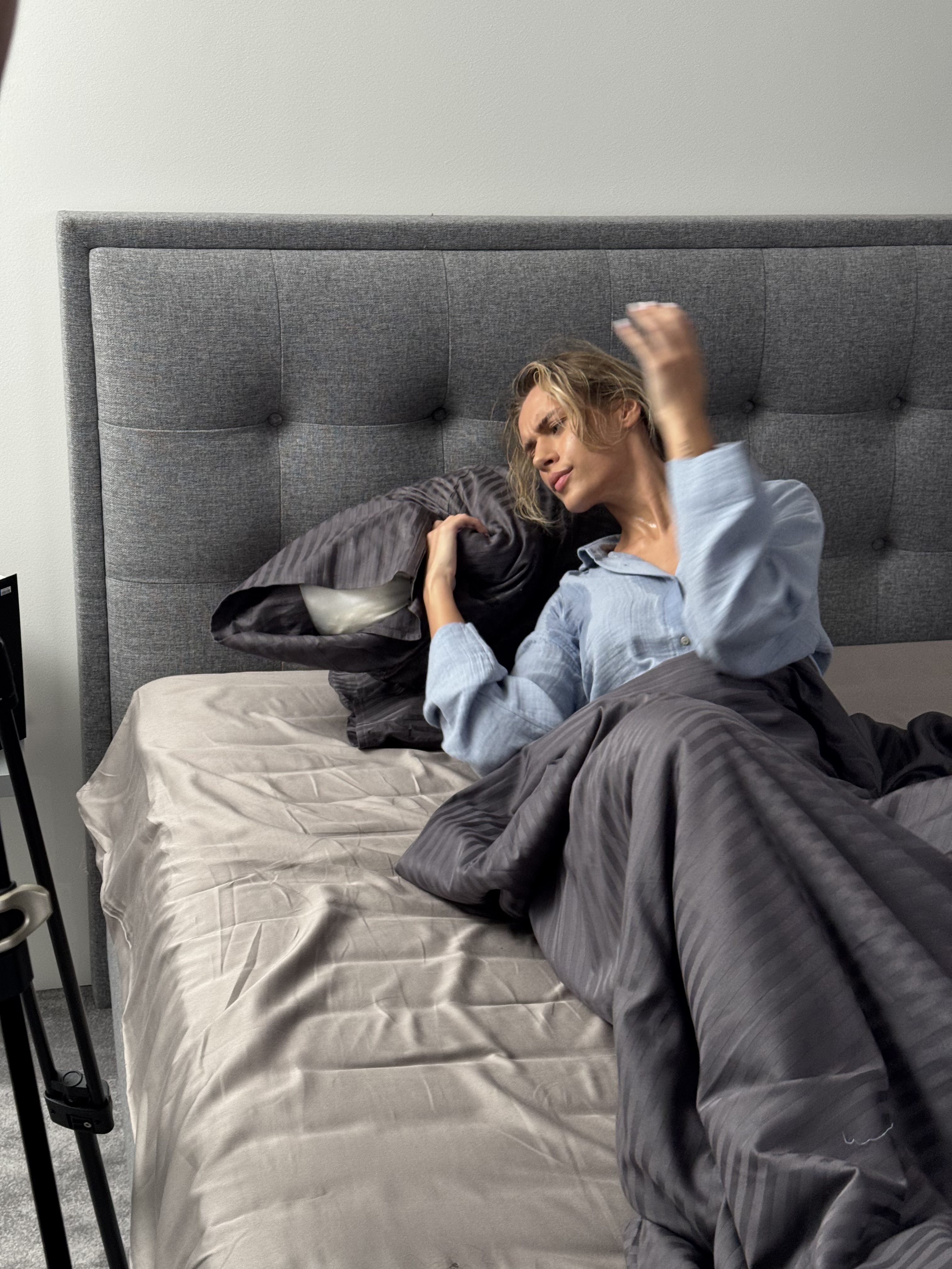 Woman in pain after waking up with severe neck pain